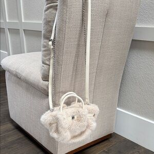 Cream colored faux fur bag